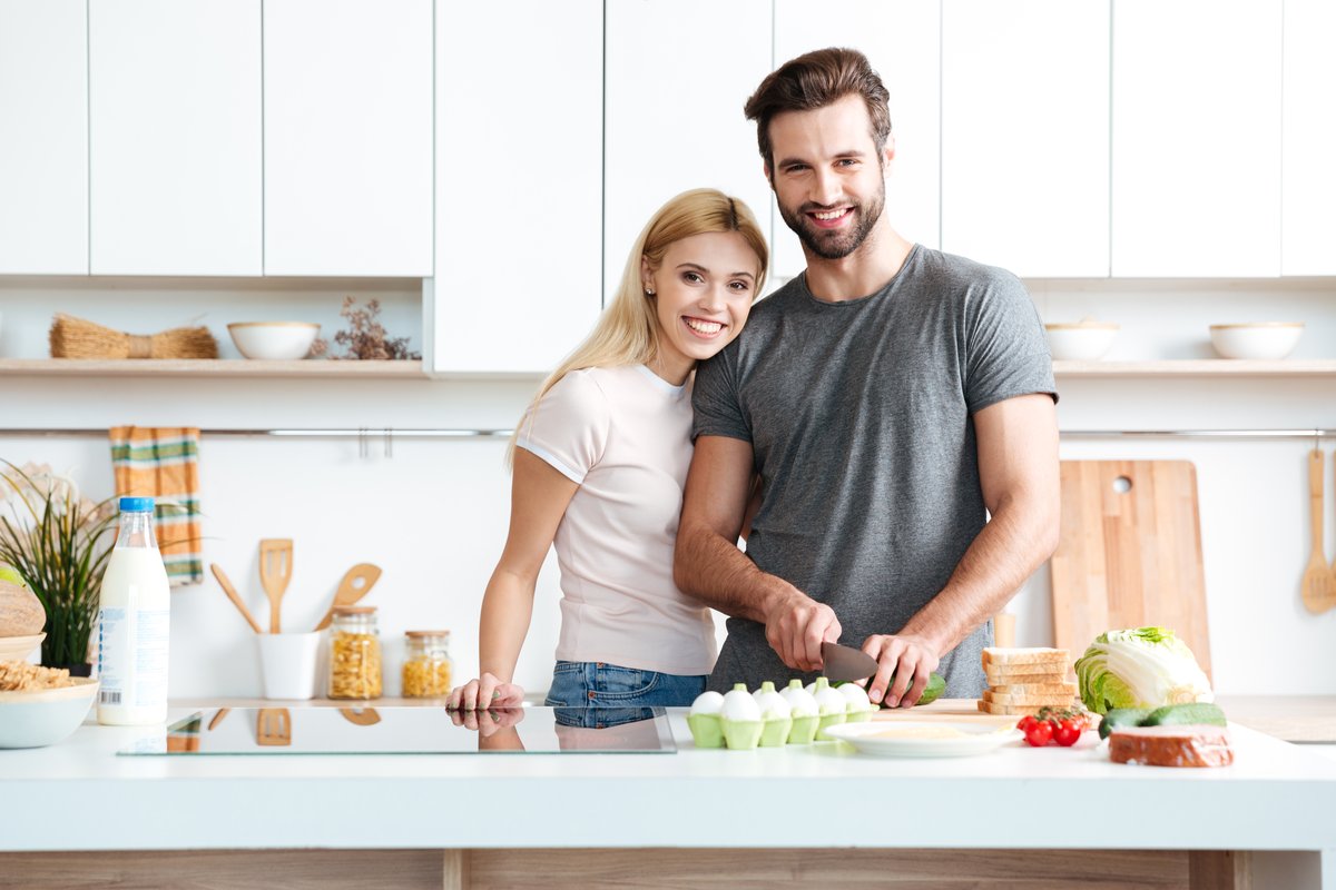 storyblocks-married-young-couple-enjoying-their-time-at-home-while-cooking-in-the-kitchen_rRMNmaoTcW.jpg